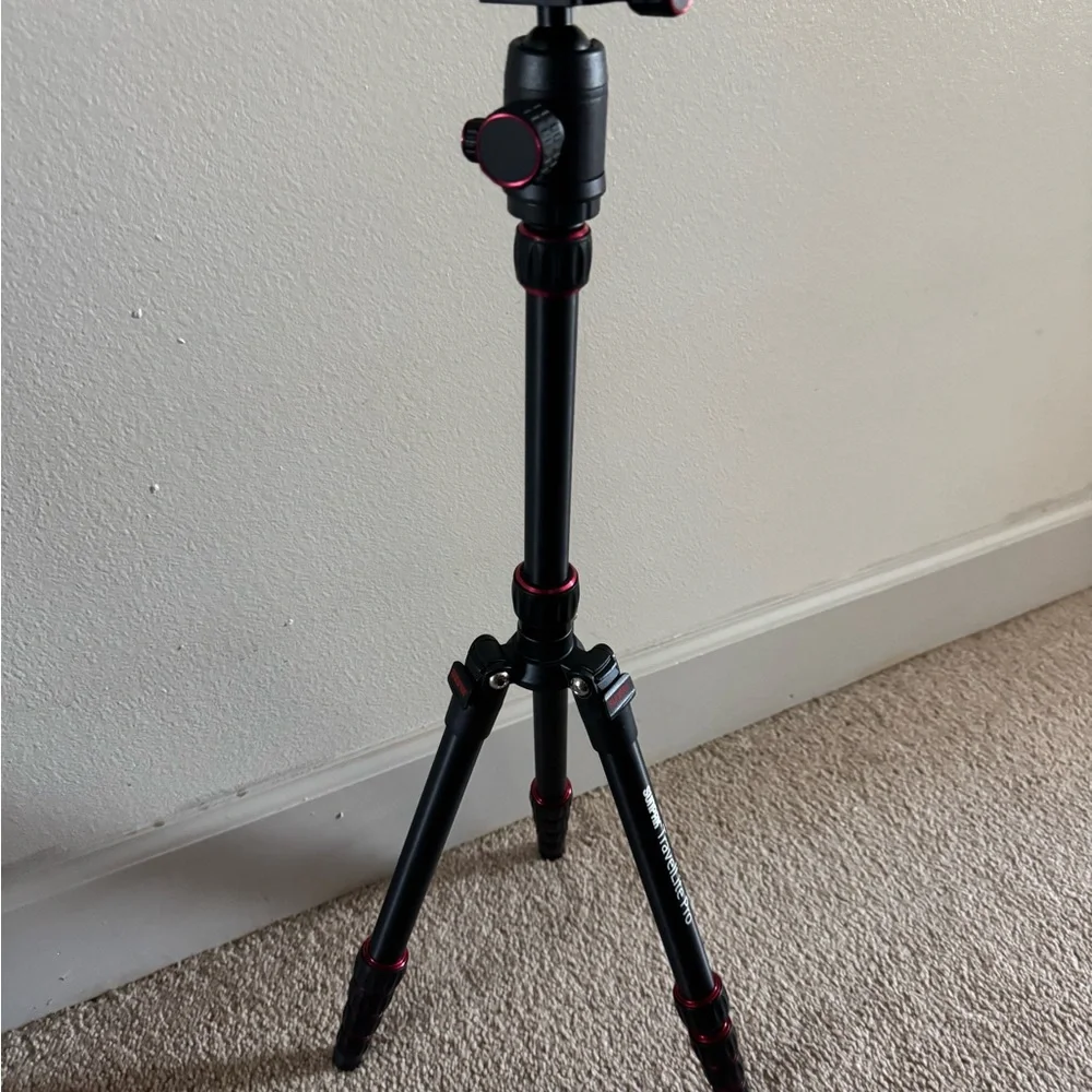 Compact Black Tripod with Red Accents